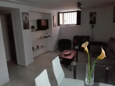 Una televisión o centro de entretenimiento en Apartamento duplex en centro de Sevilla