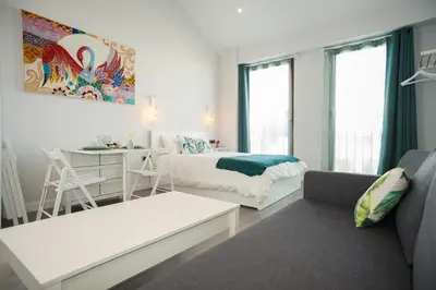 Cama o camas de una habitación en Algo Diferente Apartamentos