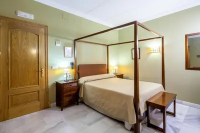 Cama o camas de una habitación en Hotel Las Casas del Duque