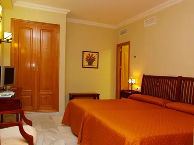 Cama o camas de una habitación en Hotel Las Casas del Duque