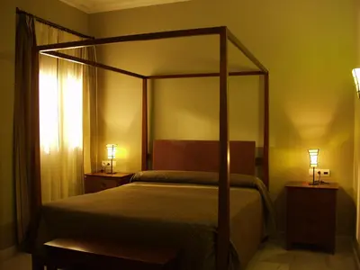 Cama o camas de una habitación en Hotel Las Casas del Duque