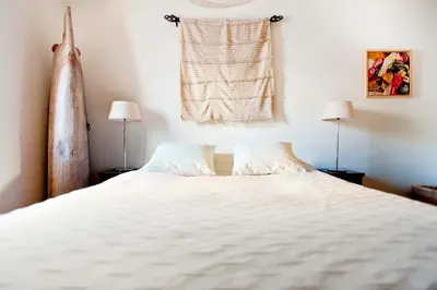 Cama o camas de una habitación en Un Oasis en el Corazón de Sevilla
