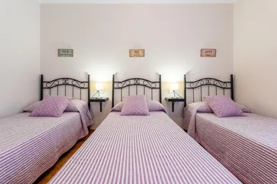 Cama o camas de una habitación en Casa Angelita Caminito del Rey, Dúplex con terraza en el centro de Andalucía
