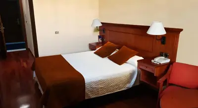 Cama o camas de una habitación en Hotel Lozano