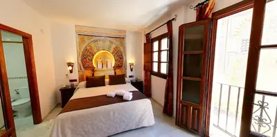 Cama o camas de una habitación en Hotel Casa Museo de la Mezquita