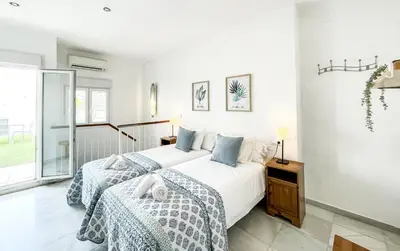 Cama o camas de una habitación en San Marcos Apartamentos