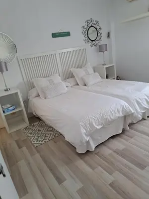Cama o camas de una habitación en Apartamentos Flamenco B&B