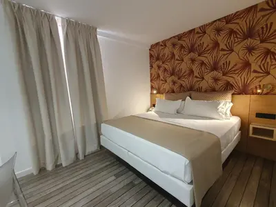 Cama o camas de una habitación en La Boutique Puerta Osario