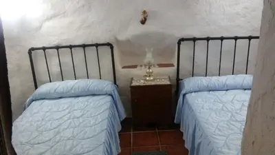 Cama o camas de una habitación en Cueva Rural La Noguera