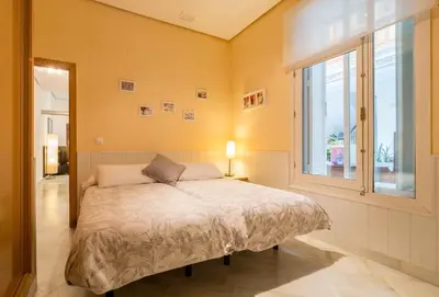 Cama o camas de una habitación en La Casa del Conde de Gelves Apartments
