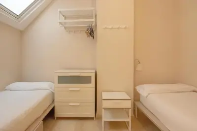 Cama o camas de una habitación en RentalSevilla Cano y Cueto II