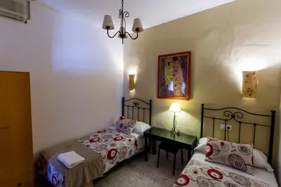 Cama o camas de una habitación en Pension el Portillo
