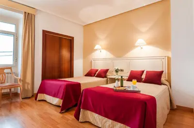 Cama o camas de una habitación en Hotel Victoria