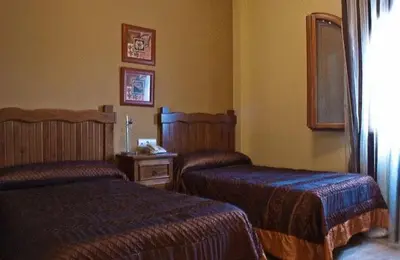 Cama o camas de una habitación en Hotel Rural Miguel Angel