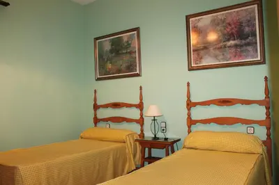 Cama o camas de una habitación en Alojamiento rural El Salto