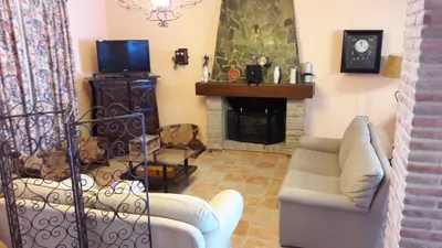 Una televisión o centro de entretenimiento en Alojamiento rural El Salto