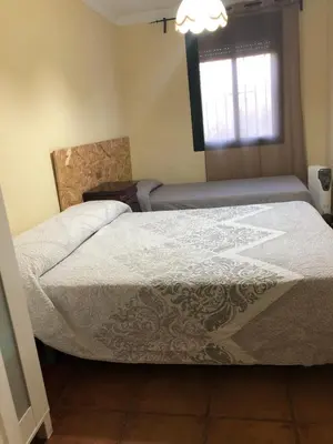 Cama o camas de una habitación en Casa rural en Constantina