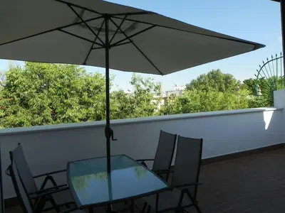 Un balcón o terraza de Atico con terraza en Alameda de Hercules