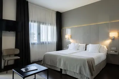 Cama o camas de una habitación en Sevilla Green Suites