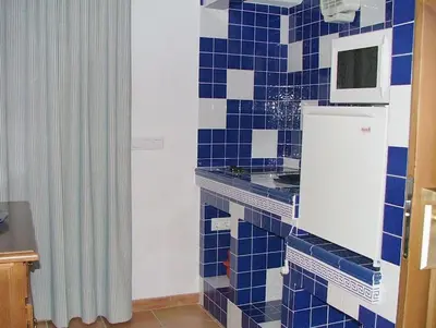Una cocina o zona de cocina en Apartamentos Rurales Alcazaba de las Torres