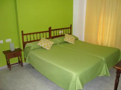 Cama o camas de una habitación en Hostal Durán