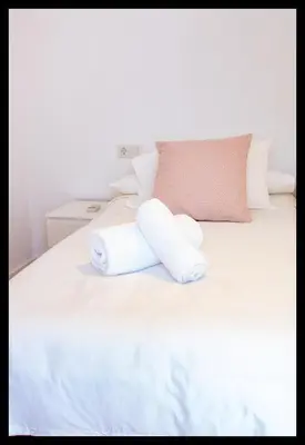 Cama o camas de una habitación en La Peluquería