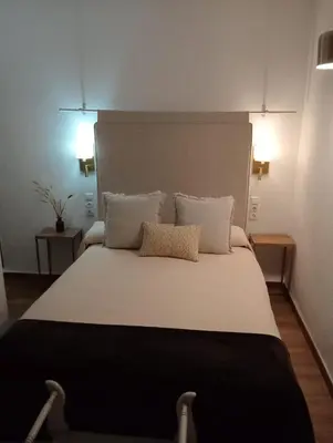 Cama o camas de una habitación en HOTEL BOUTIQUE ALMA ANDALUSí