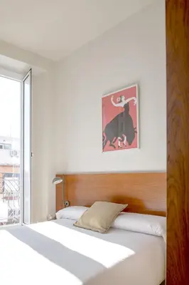 Cama o camas de una habitación en Ópera Apartments Alameda