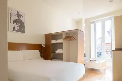 Cama o camas de una habitación en Ópera Apartments Alameda