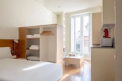 Cama o camas de una habitación en Ópera Apartments Alameda