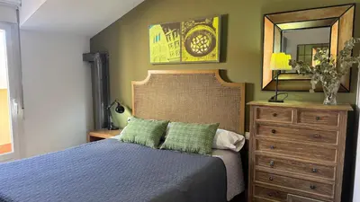 Cama o camas de una habitación en Apartamentos Alcazar de Baeza
