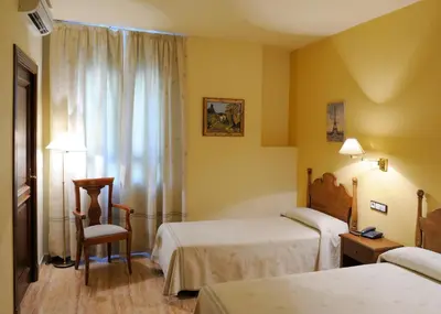 Cama o camas de una habitación en Hotel El Oasis