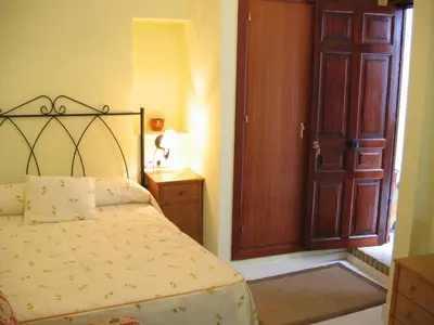 Cama o camas de una habitación en Pensión La Montoreña