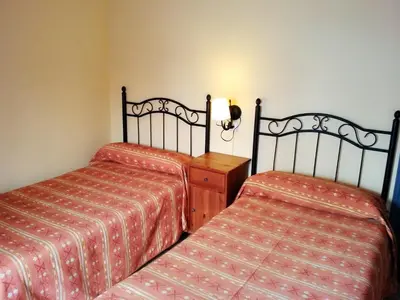 Cama o camas de una habitación en Pensión La Montoreña