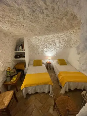Cama o camas de una habitación en Cueva El Madrono