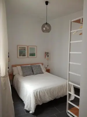 Cama o camas de una habitación en Tu Patio en Sevilla