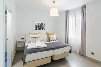 Cama o camas de una habitación en Apartamentos Tendillas