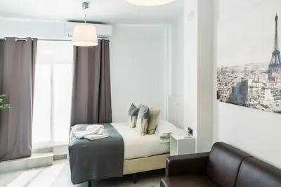 Cama o camas de una habitación en Apartamentos Tendillas