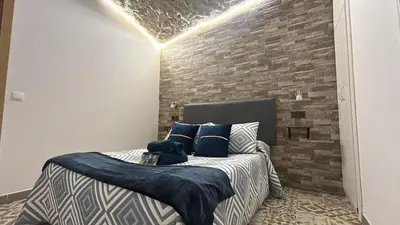 Cama o camas de una habitación en Casa entre Rocas Setenil