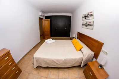 Cama o camas de una habitación en Apartamento Los Arcos