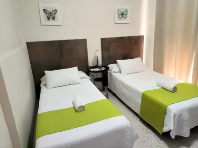 Cama o camas de una habitación en Pension Perez Montilla