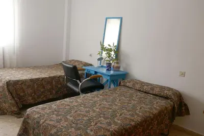 Cama o camas de una habitación en Casa Soleada Calle Tranquila Junto a FIBES