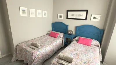 Cama o camas de una habitación en Casa San Martín Sevilla