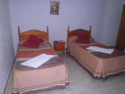 Cama o camas de una habitación en Pension Gran Plaza