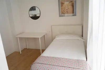 Cama o camas de una habitación en Rastro Jardines de Murillo, by Homing U
