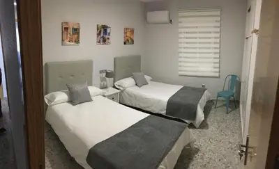 Cama o camas de una habitación en Piso La Compañía