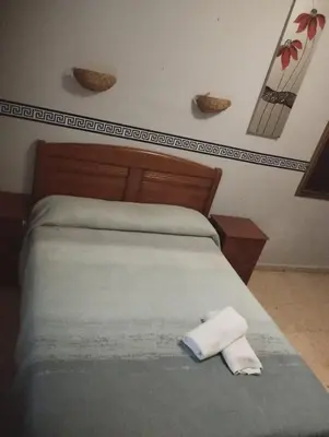 Cama o camas de una habitación en Hospedería Lucano