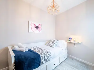 Cama o camas de una habitación en Apartamentos San Pedro