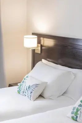 Cama o camas de una habitación en Itaca Colón by Soho Boutique