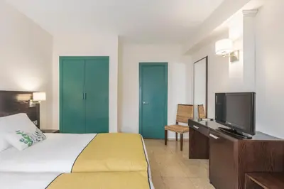 Cama o camas de una habitación en Itaca Colón by Soho Boutique
